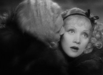 Movie still from “The Scarlet Empress” (1934), directed by Josef von Sternberg – An old photo of a woman looking into a mirror; Close Up shot, Over the shoulder angle