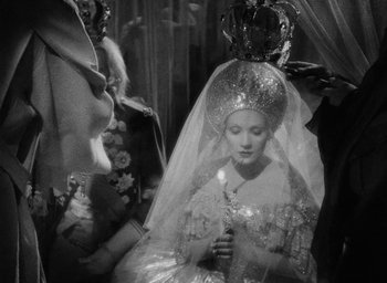 Movie still from “The Scarlet Empress” (1934), directed by Josef von Sternberg – A woman wearing a veil and a crown; Close Up shot, High angle