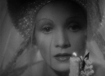 Movie still from “The Scarlet Empress” (1934), directed by Josef von Sternberg – A black - and - white photo of a woman's face; Close Up shot, High angle