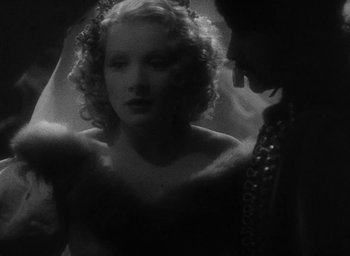 Movie still from “The Scarlet Empress” (1934), directed by Josef von Sternberg – A black - and - white photo of a woman and a man; Close Up shot, Low angle