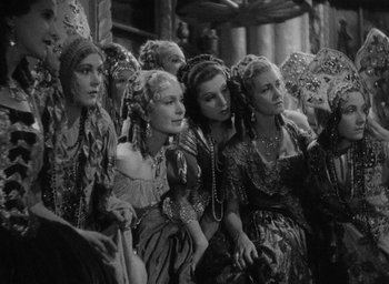 Movie still from “The Scarlet Empress” (1934), directed by Josef von Sternberg – A black and white photo of a group of women; Medium shot, High angle
