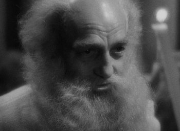 Movie still from “The Scarlet Empress” (1934), directed by Josef von Sternberg – An old man with a long white beard; Close Up shot, High angle