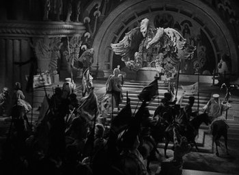 Movie still from “The Scarlet Empress” (1934), directed by Josef von Sternberg – A group of people standing on top of a staircase; Extreme Wide shot, High angle