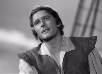 Movie still from “The Sea Hawk” (1940), directed by Michael Curtiz – Black and white photograph of a man looking up; Close Up shot, Low angle