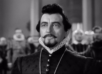 Movie still from “The Sea Hawk” (1940), directed by Michael Curtiz – A black and white photo of a man with a beard; Close Up shot, Low angle