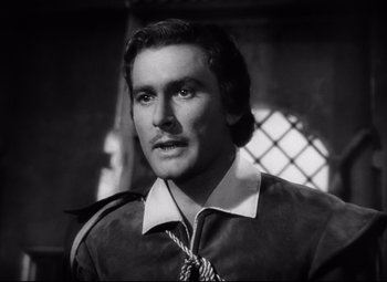 Movie still from “The Sea Hawk” (1940), directed by Michael Curtiz – Black and white photograph of a man with a mustache; Close Up shot, High angle