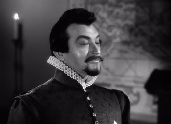 Movie still from “The Sea Hawk” (1940), directed by Michael Curtiz – A black and white photo of a man with a mustache; Close Up shot, Low angle