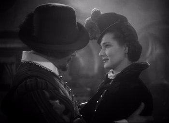 Movie still from “The Sea Hawk” (1940), directed by Michael Curtiz – A man and a woman are looking at one another; Close Up shot, Over the shoulder angle