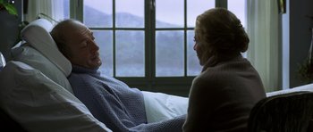 Movie still from “The Sea Inside” (2004), directed by Alejandro Amenábar – A man and a woman sitting in a bed; Medium shot, Over the shoulder angle