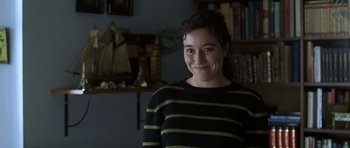 Movie still from “The Sea Inside” (2004), directed by Alejandro Amenábar – A woman in a black and yellow striped sweater; Close Up shot, Over the shoulder angle