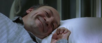 Movie still from “The Sea Inside” (2004), directed by Alejandro Amenábar – A person laying in a bed; Close Up shot, Overhead angle