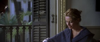 Movie still from “The Sea Inside” (2004), directed by Alejandro Amenábar – A woman in a blue sweater is looking at a window; Close Up shot, Over the shoulder angle