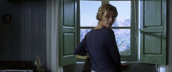 Movie still from “The Sea Inside” (2004), directed by Alejandro Amenábar – A woman standing in front of a window; Medium shot, Low angle