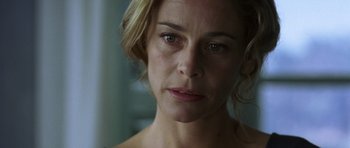 Movie still from “The Sea Inside” (2004), directed by Alejandro Amenábar – A woman's face in a dark room; Close Up shot, Low angle