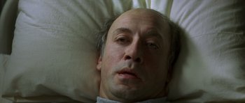 Movie still from “The Sea Inside” (2004), directed by Alejandro Amenábar – A person laying in a bed; Close Up shot, Overhead angle
