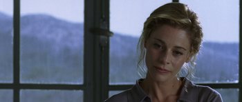 Movie still from “The Sea Inside” (2004), directed by Alejandro Amenábar – A woman standing in front of a window with mountains in the background; Close Up shot, Over the shoulder angle