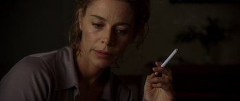 Movie still from “The Sea Inside” (2004), directed by Alejandro Amenábar – A person holding a cigarette; Close Up shot, Low angle