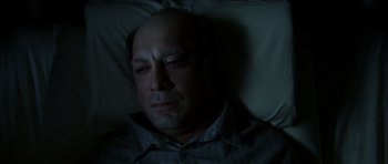 Movie still from “The Sea Inside” (2004), directed by Alejandro Amenábar – A man laying in a bed in the middle of the night; Close Up shot, High angle