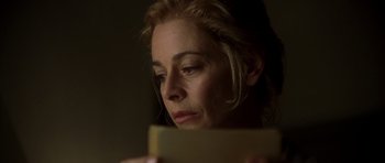 Movie still from “The Sea Inside” (2004), directed by Alejandro Amenábar – A person looking at a book; Close Up shot, Low angle