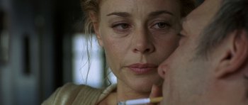 Movie still from “The Sea Inside” (2004), directed by Alejandro Amenábar – A person holding a cigarette in their mouth; Close Up shot, Over the shoulder angle