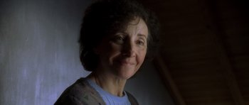 Movie still from “The Sea Inside” (2004), directed by Alejandro Amenábar – An older woman smiling for the camera; Close Up shot, Low angle