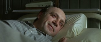 Movie still from “The Sea Inside” (2004), directed by Alejandro Amenábar – A man laying in a bed with his head resting on a pillow; Close Up shot, High angle