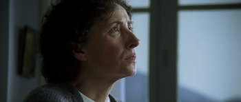 Movie still from “The Sea Inside” (2004), directed by Alejandro Amenábar – An older woman looking off into the distance; Close Up shot, Low angle