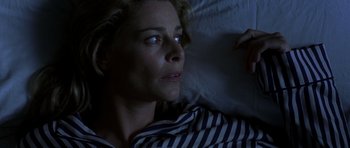 Movie still from “The Sea Inside” (2004), directed by Alejandro Amenábar – A person laying in bed at night; Close Up shot, Overhead angle