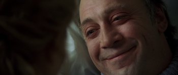 Movie still from “The Sea Inside” (2004), directed by Alejandro Amenábar – An older man smiling with his eyes closed; Close Up shot, Low angle