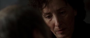 Movie still from “The Sea Inside” (2004), directed by Alejandro Amenábar – An older woman looking down at her face; Close Up shot, Over the shoulder angle