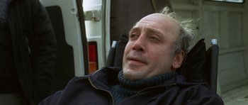 Movie still from “The Sea Inside” (2004), directed by Alejandro Amenábar – A man sitting in a chair looking up at the sky; Close Up shot, Low angle