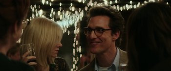 Movie still from “The Sea of Trees” (2015), directed by Gus Van Sant – A man and a woman are standing in front of lights; Close Up shot, Over the shoulder angle