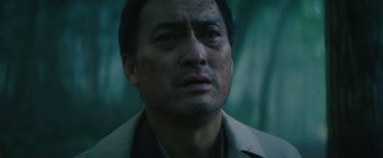 Movie still from “The Sea of Trees” (2015), directed by Gus Van Sant – A person wearing a jacket; Close Up shot, Low angle