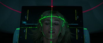 Movie still from “The Sea of Trees” (2015), directed by Gus Van Sant – A woman with a green light on her face; Close Up shot, Overhead angle