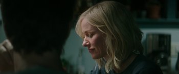 Movie still from “The Sea of Trees” (2015), directed by Gus Van Sant – A woman with blonde hair looking down at her face; Close Up shot, Over the shoulder angle