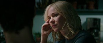 Movie still from “The Sea of Trees” (2015), directed by Gus Van Sant – A woman with blonde hair is looking off to the side; Close Up shot, Over the shoulder angle