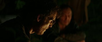 Movie still from “The Sea of Trees” (2015), directed by Gus Van Sant – A man with glasses is looking at another man with glasses; Close Up shot, Over the shoulder angle