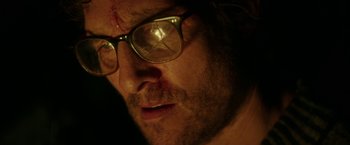 Movie still from “The Sea of Trees” (2015), directed by Gus Van Sant – A person wearing glasses; Extreme Close Up shot, Over the shoulder angle