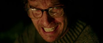Movie still from “The Sea of Trees” (2015), directed by Gus Van Sant – A person wearing glasses; Close Up shot, Low angle