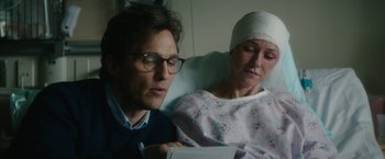 Movie still from “The Sea of Trees” (2015), directed by Gus Van Sant – A man and a woman sitting in a hospital bed; Close Up shot, Over the shoulder angle