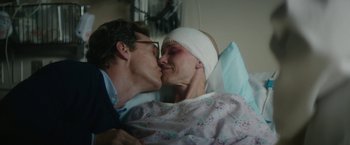 Movie still from “The Sea of Trees” (2015), directed by Gus Van Sant – A man and a woman kissing in a hospital bed; Close Up shot, Over the shoulder angle