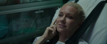 Movie still from “The Sea of Trees” (2015), directed by Gus Van Sant – A woman sitting in a chair talking on a cell phone; Close Up shot, Over the shoulder angle