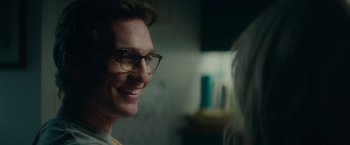 Movie still from “The Sea of Trees” (2015), directed by Gus Van Sant – A person wearing glasses; Close Up shot, Over the shoulder angle