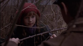 Movie still from “The Secret Garden” (1993), directed by Agnieszka Holland – A young girl holding a pair of scissors in her hand; Close Up shot, Over the shoulder angle