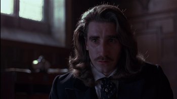 Movie still from “The Secret Garden” (1993), directed by Agnieszka Holland – A person wearing a suit and tie; Close Up shot, Low angle