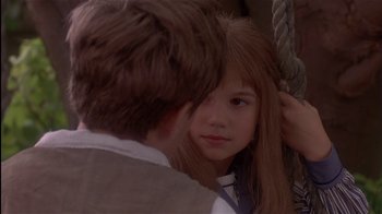 Movie still from “The Secret Garden” (1993), directed by Agnieszka Holland – A young girl with long brown hair is looking at a young man; Close Up shot, Over the shoulder angle