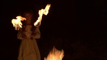 Movie still from “The Secret Garden” (1993), directed by Agnieszka Holland – A little girl is holding a fire in her hand; Medium shot, Over the shoulder angle