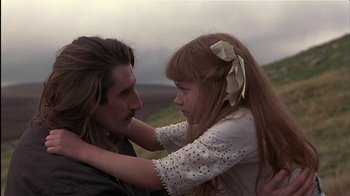 Movie still from “The Secret Garden” (1993), directed by Agnieszka Holland – A man and a little girl are hugging each other; Close Up shot, Over the shoulder angle