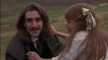 Movie still from “The Secret Garden” (1993), directed by Agnieszka Holland – A little girl is hugging a man in a suit; Close Up shot, Over the shoulder angle