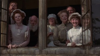Movie still from “The Secret Garden” (1993), directed by Agnieszka Holland – A group of people standing next to each other; Medium shot, Low angle